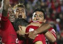 Varios jugadores de los Xolos de Tijuana celebran una de las dos anotaciones con las que su equipo derrotó al Pachuca y se quedó con el liderato del torneo mexicano.