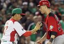 El equipo de Canadá celebra su victoria ante el equipo de México en la primera ronda del Clásico Mundial de Béisbol en Phoenix, Arizona, EE.UU.