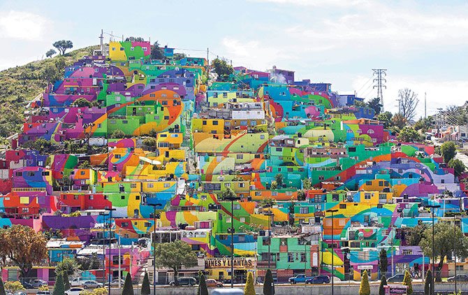 De barrio descolorido a mural multicolor