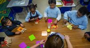 Spanish teacher Mariluz Mendez works with her students, left to right, Yaritza Martinez, Adejolee Adebiyi, Yukari Lopez and Dominick Ricks on match exercises at Cesar Chavez Elementary School in Hyattsville, Md.