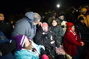 AYUNO. Lenka Mendoza (centro) con su esposo Carlos y su hija Fiorella el 20 de noviembre de 2014  al levantar el ayuno de 18 días tras el anuncio del presidente Barack Obama de las acciones ejecutivas.