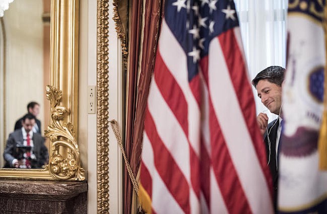 El presidente de la Cámara de Representantes Paul Ryan, R-Wis., hace llamadas en su oficina ceremonial el primer día del 115º Congreso el martes.