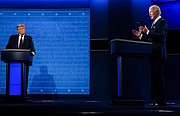 DEBATE. El presidente Trump observa mientras el ex vicepresidente Joe Biden habla durante el primer debate presidencial realizado la noche del martes 29 de septiembre en Case Western Reserve University en Cleveland. | FOTO: Melina Mara — The Washington Post